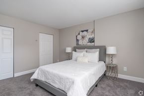 Barrington apartment for rent - A bedroom with a large bed and two lamps.