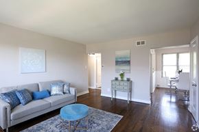 Collingswood apartment for rent - A living room with a couch, a chair, and a table.