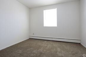 Pottstown apartment for rent - A room with a carpeted floor and a window.