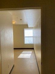 Fort Morgan townhouse for rent - an empty living room with a window in it