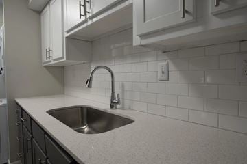 Roswell apartment for rent - A kitchen with a sink and a faucet.