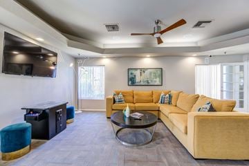 Glendale apartment for rent - A living room with a yellow couch and a coffee table.