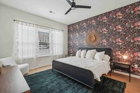 Charlotte apartment for rent - a bedroom with a bed and a ceiling fan