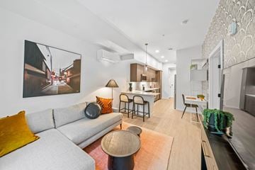 Redmond apartment for rent - A modern living room with a grey couch and a large painting on the wall.