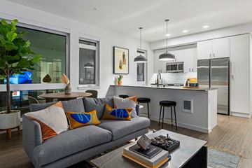 Redmond apartment for rent - A modern living room with a grey couch and a coffee table.
