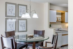 Jackson apartment for rent - A modern dining room with a glass table and chairs.