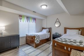 Jackson apartment for rent - A bedroom with two beds and a nightstand.