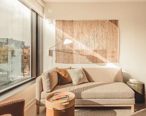 Atlanta apartment for rent - a living room with a couch and a window at Scout Living, powered by Placemakr Apartments, Atlanta, GA