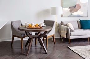 Pittsburgh apartment for rent - A modern dining room with a round table and chairs at The Pennsylvanian Apartments, Pittsburgh, PA