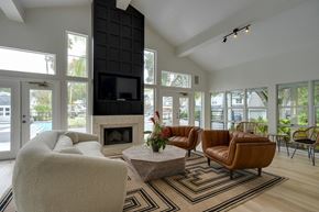 Jacksonville apartment for rent - A living room with a fireplace and a television.