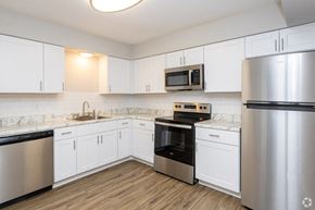 Lexington apartment for rent - A kitchen with white cabinets and stainless steel appliances.