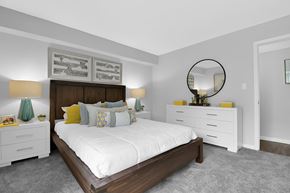 Lexington apartment for rent - A bedroom with a large bed, nightstands, and a mirror.