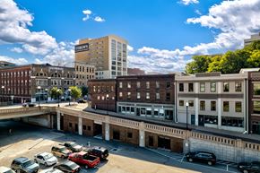Knoxville apartment for rent - A parking lot with cars and a building with a sign that says "St. Croix's".