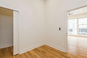 Knoxville apartment for rent - a bedroom with a medium hardwood floor and white walls