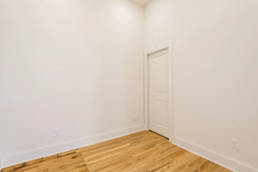 Knoxville apartment for rent - a bedroom with white walls and a wooden floor