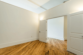 Knoxville apartment for rent - a bedroom with white walls and a wooden floor
