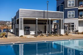 Louisville apartment for rent - A modern house with a pool in front.