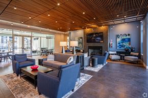 Louisville apartment for rent - A living room with a fireplace and a television.