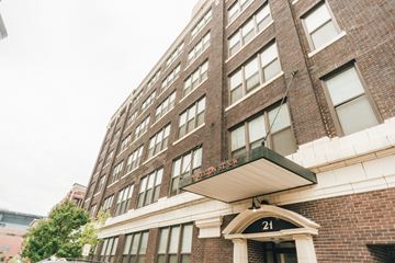 Grand Rapids apartment for rent - a tall brick building with a sign on the front of it