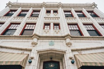 Grand Rapids apartment for rent - the front of a white building with red windows