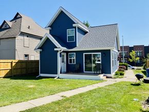 Grand Rapids apartment for rent - blue sided home backyard