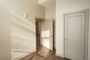 Grand Rapids apartment for rent - bedroom with white walls and greige trim