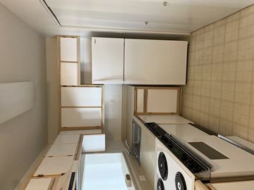 Mcminnville apartment for rent - A kitchen with a stove top oven and a refrigerator.