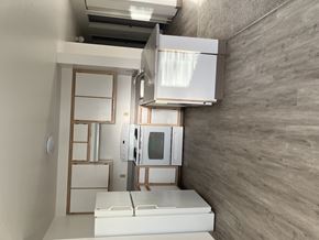 Mcminnville apartment for rent - A modern kitchen with a white fridge and microwave.
