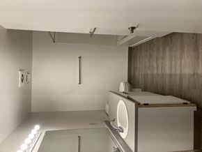Mcminnville apartment for rent - A modern bathroom with a toilet, sink, and mirror.
