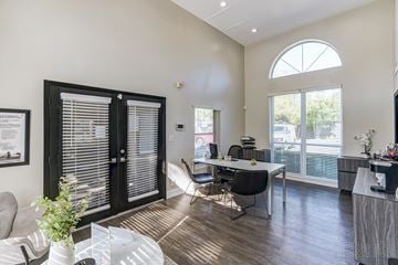 Dallas apartment for rent - a living room with a table and chairs and a window