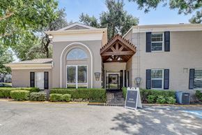 Dallas apartment for rent - a building with a sign in front of it