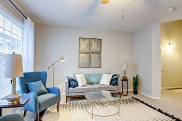 Woodbury apartment for rent - a living room with a couch and two chairs
