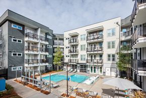 Charlotte apartment for rent - an apartment building with a pool and a swimming pool
