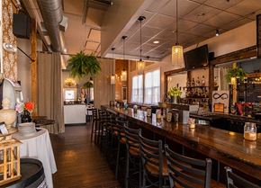 Conshohocken apartment for rent - a long bar in a restaurant with tables and chairs