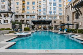 Denver apartment for rent - A large swimming pool in front of apartment buildings.