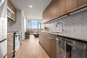Seattle apartment for rent - kitchen with wooden cabinets and stainless steel appliances