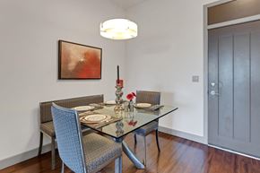 Jacksonville apartment for rent - a dining room with a glass table and chairs