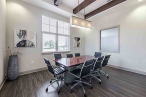 Austin apartment for rent - A conference room with a large table and chairs at 95twenty Apartments, Austin, TX, 78717