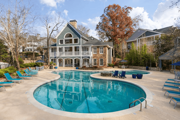 Alpharetta apartment for rent - A large house with a pool in the backyard.