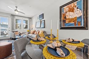 Melbourne apartment for rent - A dining room with a table set for two and a painting on the wall.