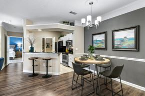 Alpharetta apartment for rent - A modern kitchen with a dining table set for two.