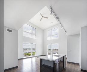 Boston apartment for rent - a living room with a large window and a table