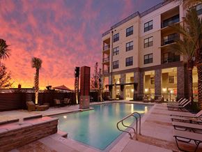 Jacksonville apartment for rent - a swimming pool with a sunset in the background