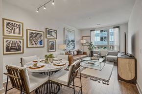 Cambridge apartment for rent - the living room of an apartment with a table and chairs