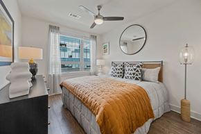 Cambridge apartment for rent - a bedroom with a bed and a ceiling fan