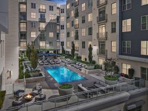 Cambridge apartment for rent - an apartment building with a swimming pool in the middle