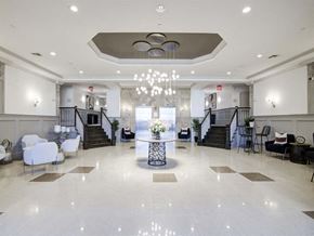 Valley Stream apartment for rent - a lobby with a table and chairs and a chandelier