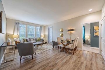 Denver apartment for rent - A living room with a grey sofa and wooden floors.