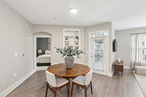 Atlanta apartment for rent - A dining room with a wooden table and chairs.