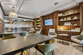 Dallas apartment for rent - A modern dining room with a large table and chairs.